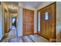 Bright entryway with wood flooring and access to other rooms at 4135 Surrey Ct, Lafayette, CO 80026