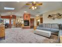 Spacious living room featuring a fireplace and an open floor plan at 4135 Surrey Ct, Lafayette, CO 80026