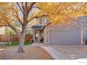 Townhome with attached garage and walkway at 421 Stevens Cir, Platteville, CO 80651