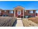 Brick building with covered entryway and walkway at 5425 County Road 32, Mead, CO 80504