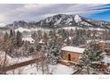 Snow covered neighborhood with mountain views at 707 14Th St, Boulder, CO 80302