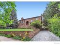 Stone house with landscaping and driveway at 707 14Th St, Boulder, CO 80302