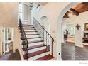 Elegant wooden staircase with iron railing at 707 14Th St, Boulder, CO 80302