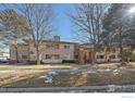 Neat exterior of a condo building, well-maintained landscaping at 770 Copper Ln # 206, Louisville, CO 80027