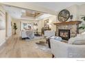 Spacious living room with a fireplace and hardwood floors at 81 Benthaven Pl, Boulder, CO 80305