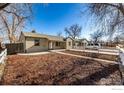 Charming Ranch home with a well-maintained lawn and fence at 990 Hazel Ct, Denver, CO 80204