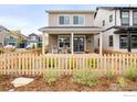 Modern two-story house with front porch and picket fence at 129 Mesa Way, Superior, CO 80027