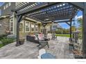 Outdoor patio with seating area and pergola at 16060 E Fairway Dr, Commerce City, CO 80022