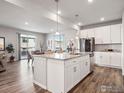 Modern kitchen featuring a large island and stainless steel appliances at 2736 Cooperland Blvd, Berthoud, CO 80513