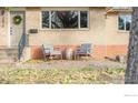 Brick front porch with rocking chairs and landscaping at 2870 15Th St, Boulder, CO 80304