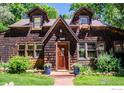 Front view of charming wood house with landscaping at 3776 Orange Ln, Boulder, CO 80304