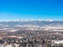 Aerial view of neighborhood with snow-covered landscape and mountains at 4667 Ashfield Dr, Boulder, CO 80301