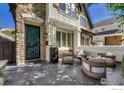 Cozy front patio with seating area, fire pit, and modern furniture at 538 Madison St, Denver, CO 80206