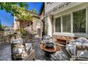 Outdoor patio with seating area and fire pit, perfect for relaxing at 538 Madison St, Denver, CO 80206