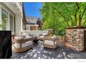 Relaxing patio with comfortable seating and a fire pit for outdoor gatherings at 538 Madison St, Denver, CO 80206