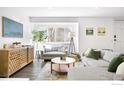 Cozy living room showcasing comfortable seating and large windows at 616 Quince Cir, Boulder, CO 80304