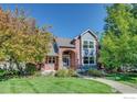 Two-story home with brick and siding exterior and landscaped yard at 6345 Swallow Ln, Boulder, CO 80303