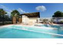 Community pool with a relaxing patio area at 6345 Swallow Ln, Boulder, CO 80303