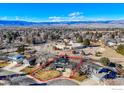 Aerial view showcasing house, yard, and neighborhood with mountain backdrop at 7913 Grasmere Dr, Boulder, CO 80301