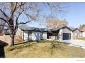 Updated ranch home with a large yard and modern curb appeal at 8193 Flower Ct, Arvada, CO 80005