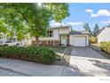 Front view of a charming house with a lush green lawn at 840 W Linden St, Louisville, CO 80027