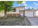 House exterior featuring a light blue front door and well-maintained landscaping at 840 W Linden St, Louisville, CO 80027