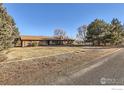 Brick ranch house with a large yard at 8847 Quail Rd, Longmont, CO 80503