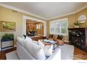 Comfortable living room with hardwood floors, a fireplace, and built-in shelving at 1521 Mapleton Ave, Boulder, CO 80304