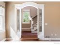 Elegant staircase with wrought iron railing and stained glass accents at 1521 Mapleton Ave, Boulder, CO 80304