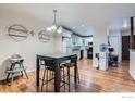 Open concept dining room with a table set and view into kitchen area at 246 S 22Nd Ave, Brighton, CO 80601