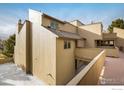 Tan building exterior with private deck at 2938 Kalmia Ave # 6, Boulder, CO 80301