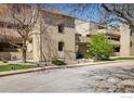 Exterior shot of the multi-story townhome with mature trees and landscaping at 2938 Kalmia Ave # 6, Boulder, CO 80301