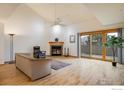 Spacious living room with fireplace and hardwood floors at 2938 Kalmia Ave # 6, Boulder, CO 80301