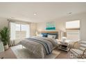 Spacious bedroom with large windows and a neutral color scheme at 2243 Crosswind St, Fort Lupton, CO 80621