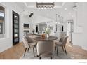Open concept dining room with view into kitchen and living room at 30410 E 161St Ave, Brighton, CO 80603