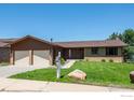 Two-car garage, curb appeal, and a well-maintained lawn at 3215 Lafayette Dr, Boulder, CO 80305