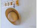 A straw hat hangs on a wooden rack in an entryway at 3707 Telluride Cir, Boulder, CO 80305