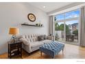 Bright living room with patio access and modern furniture at 4220 Riley Dr, Longmont, CO 80503