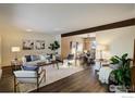 Open concept living and dining area with hardwood floors at 5375 Gunbarrel Cir, Longmont, CO 80503