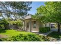 Ranch style home with green lawn and attached garage at 7329 Windsor Dr, Boulder, CO 80301