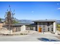 Contemporary home with mountain views and a sleek metal roof at 7373 Spring Dr, Boulder, CO 80303