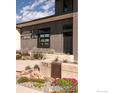 Up close, modern home with landscaped entrance and clear address numbers at 7373 at 7373 Spring Dr, Boulder, CO 80303