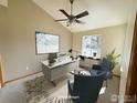 Bright, staged office with high ceilings, a ceiling fan, and a large window offering natural light at 7909 Fairfax Ct, Niwot, CO 80503