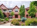 Brick building exterior with landscaping and walkway at 1379 Charles Dr # 7, Longmont, CO 80503