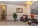 Building lobby with seating, mirror, and artwork at 1379 Charles Dr # 7, Longmont, CO 80503
