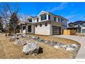 Modern farmhouse exterior, showcasing a side view and landscaping at 1831 Norwood Ave, Boulder, CO 80304