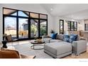 Bright and spacious living area with large windows and comfortable seating at 1831 Norwood Ave, Boulder, CO 80304
