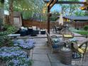 Evening view of a relaxing patio with string lights and comfortable seating at 1895 Balsam Ave, Boulder, CO 80304