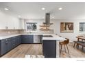 Modern kitchen with stainless steel appliances and a large island at 200 Fox Dr, Boulder, CO 80303