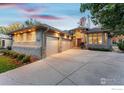 Charming home featuring a three-car garage, with brick and neutral tone finishes at 2500 Pampas Ct, Boulder, CO 80304